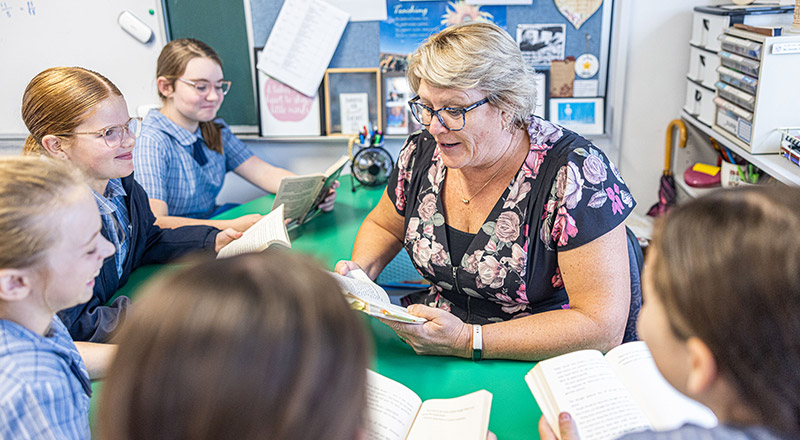 Teacher with class at Holy Family Primary Luddenham
